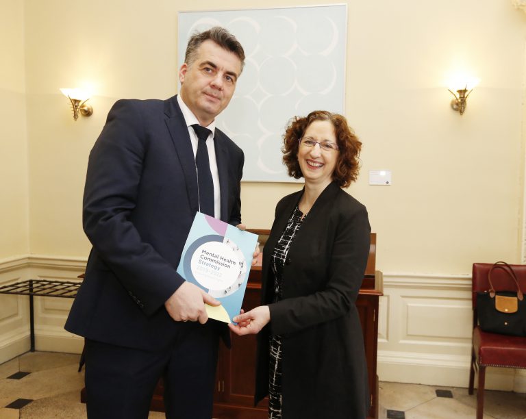 Picture of John Farrelly, Chief Executive of the Mental Health Commission and Shari McDaid, Director of Mental Health Reform, holding a copy of the Mental Health Commissions publication, "Protecting People's Rights"